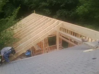 Framing a new roof addition that ties into an existing shingle roof in Hyde Park